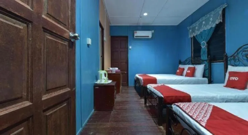 Bed in OYO 90620 Mahseer Chalet