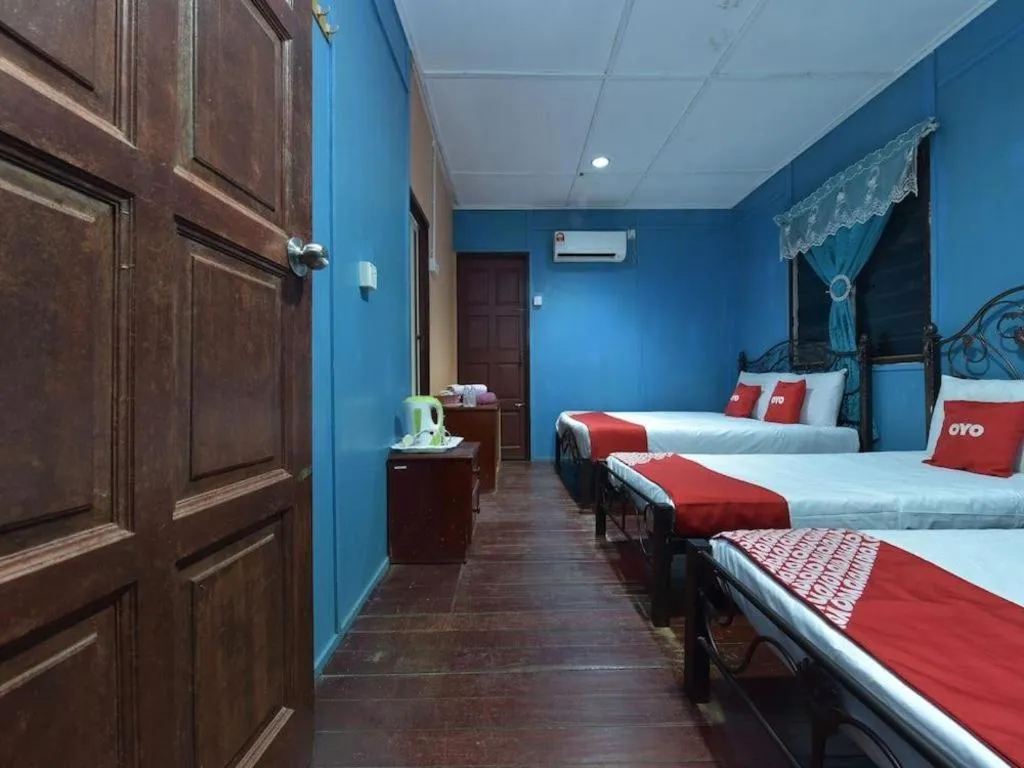 Bed in OYO 90620 Mahseer Chalet