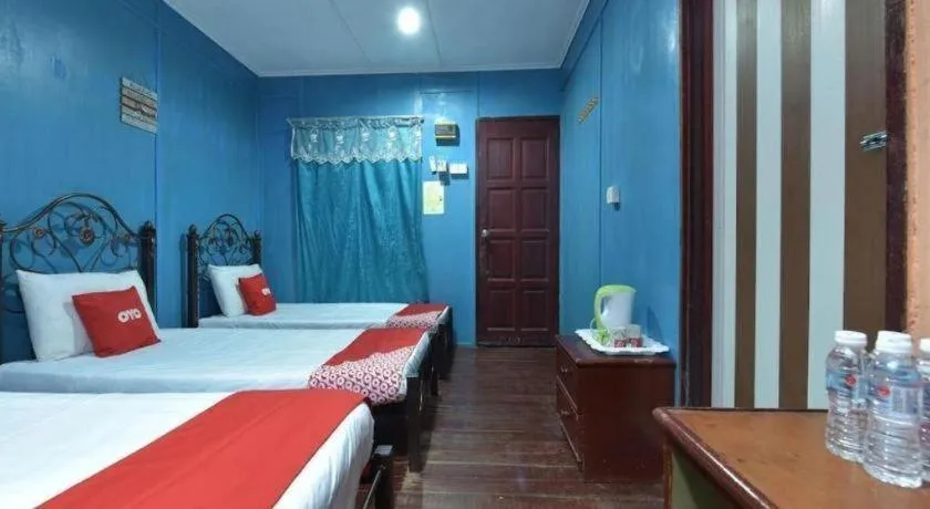 Bed in OYO 90620 Mahseer Chalet