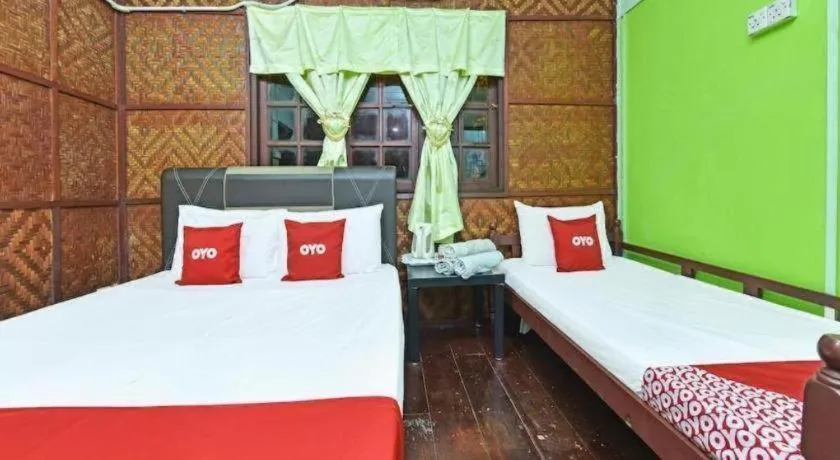 Bed in OYO 90620 Mahseer Chalet