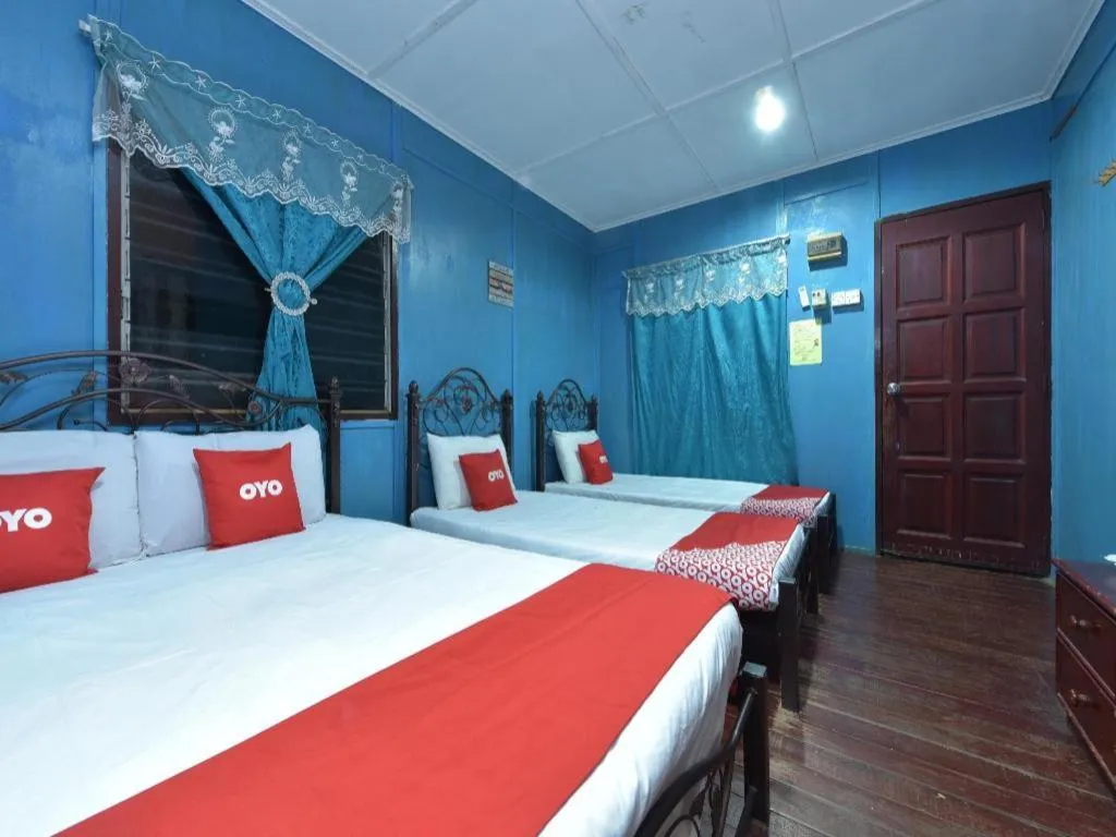 Bed in OYO 90620 Mahseer Chalet