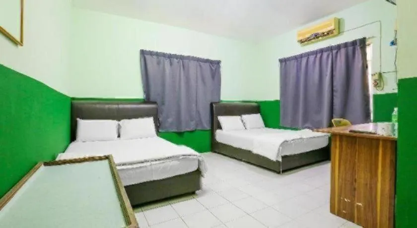 Bed in OYO 90623 Thank Q Inn 3