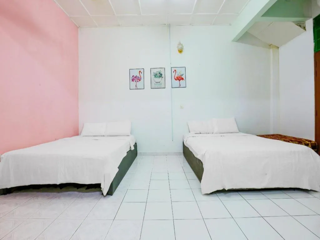 Bed in OYO 90623 Thank Q Inn 3