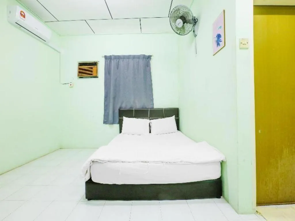 Bed in OYO 90623 Thank Q Inn 3