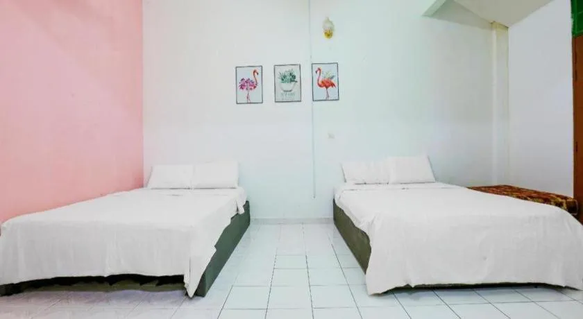 Bed in OYO 90623 Thank Q Inn 3