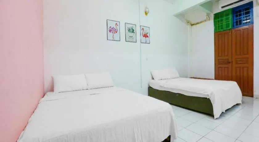 Bed in OYO 90623 Thank Q Inn 3