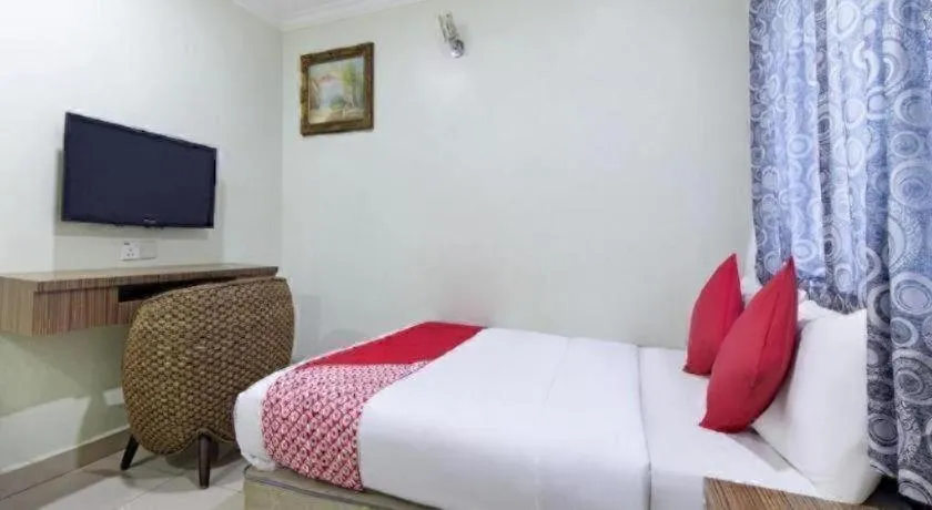 Bed in OYO 90623 Thank Q Inn 3