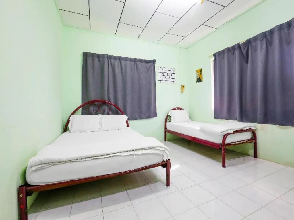 Bed in OYO 90623 Thank Q Inn 3