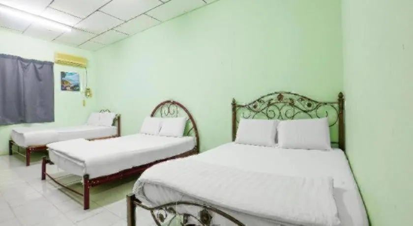 Bed in OYO 90623 Thank Q Inn 3