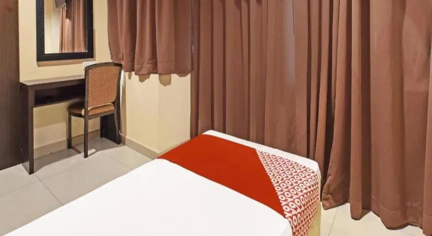 Bed in OYO 90669 My Hotel Vistana