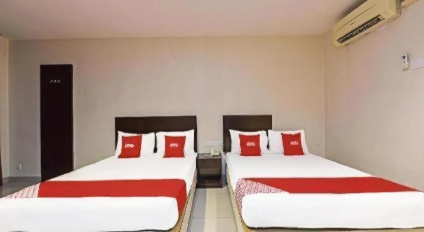 Bed in OYO 90669 My Hotel Vistana