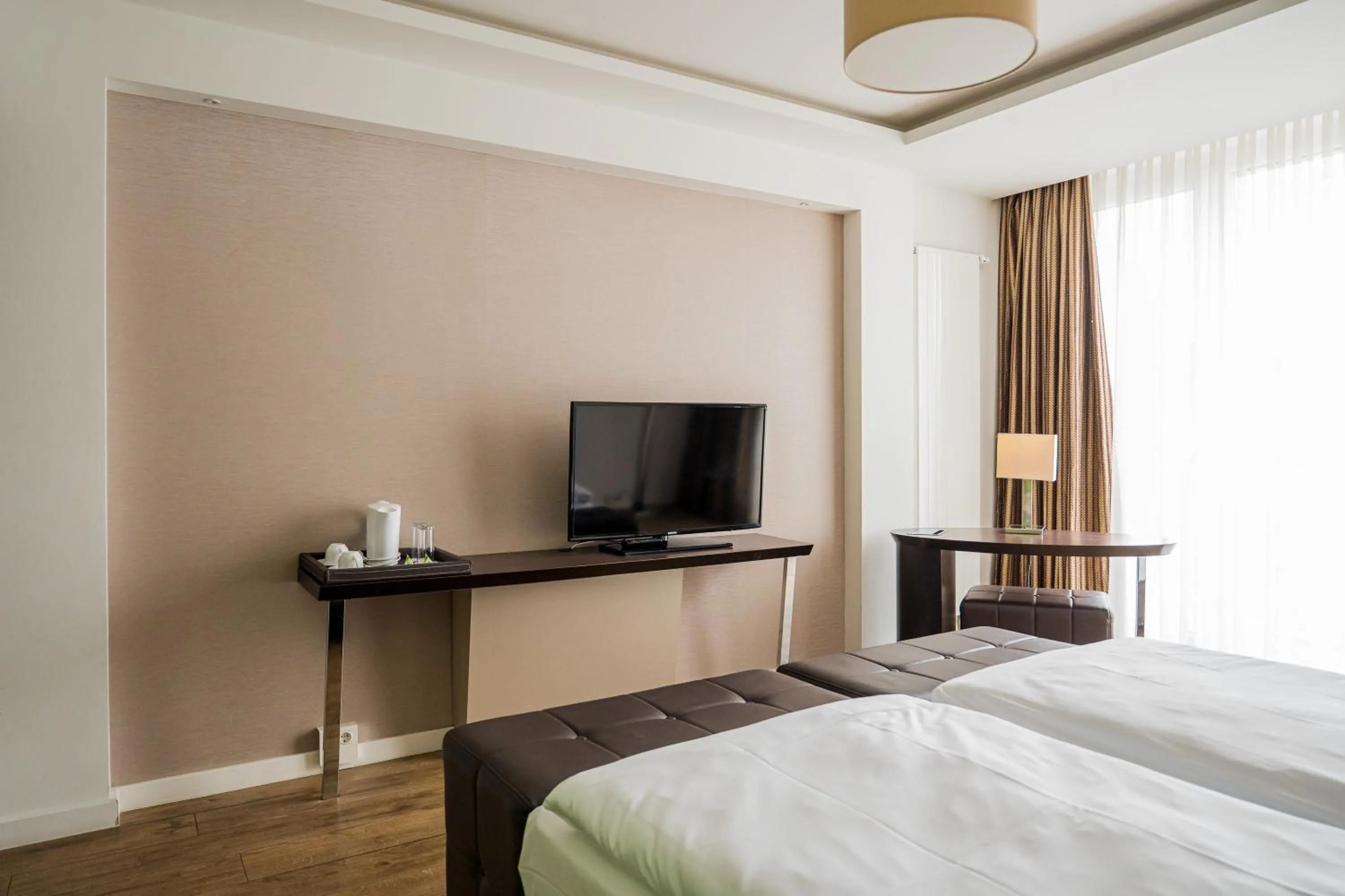 Twin Room in Homaris West Side - Self-Check In