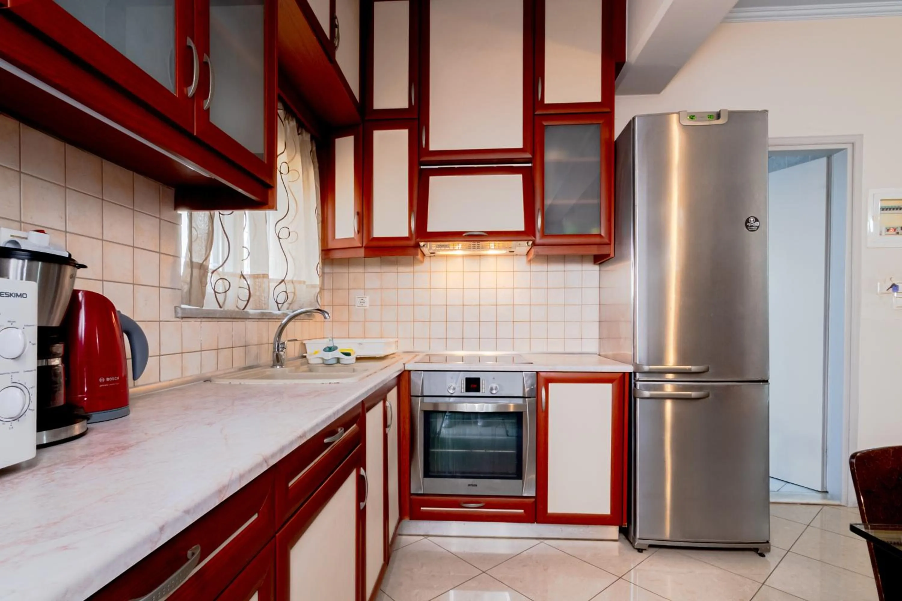 Kitchen or kitchenette in Alena Apartments
