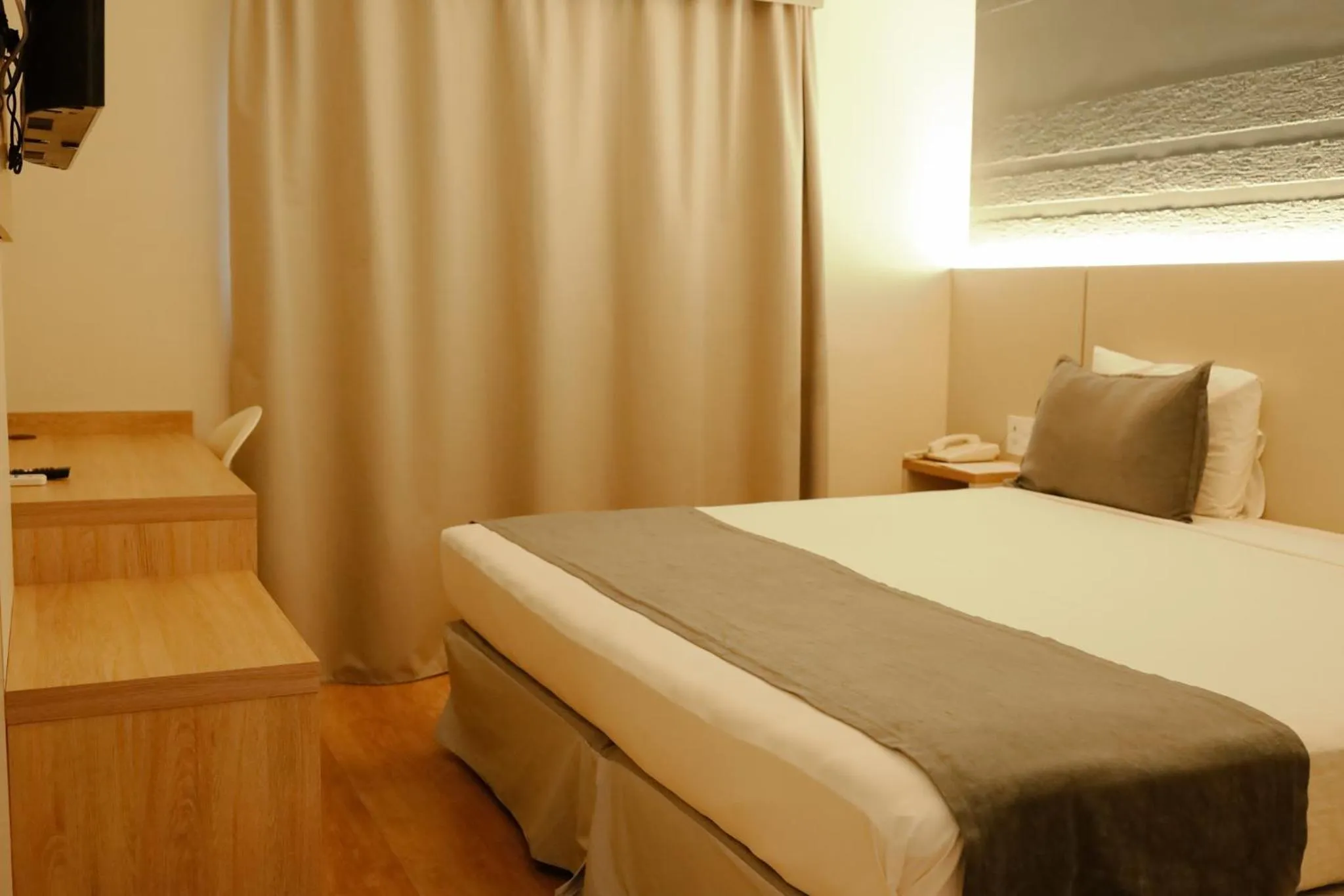 Bed in Carlton Plaza Baobá