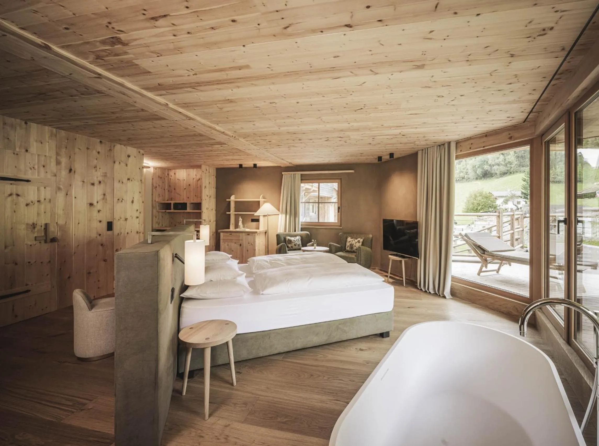 Bed in Naturhotel Lüsnerhof