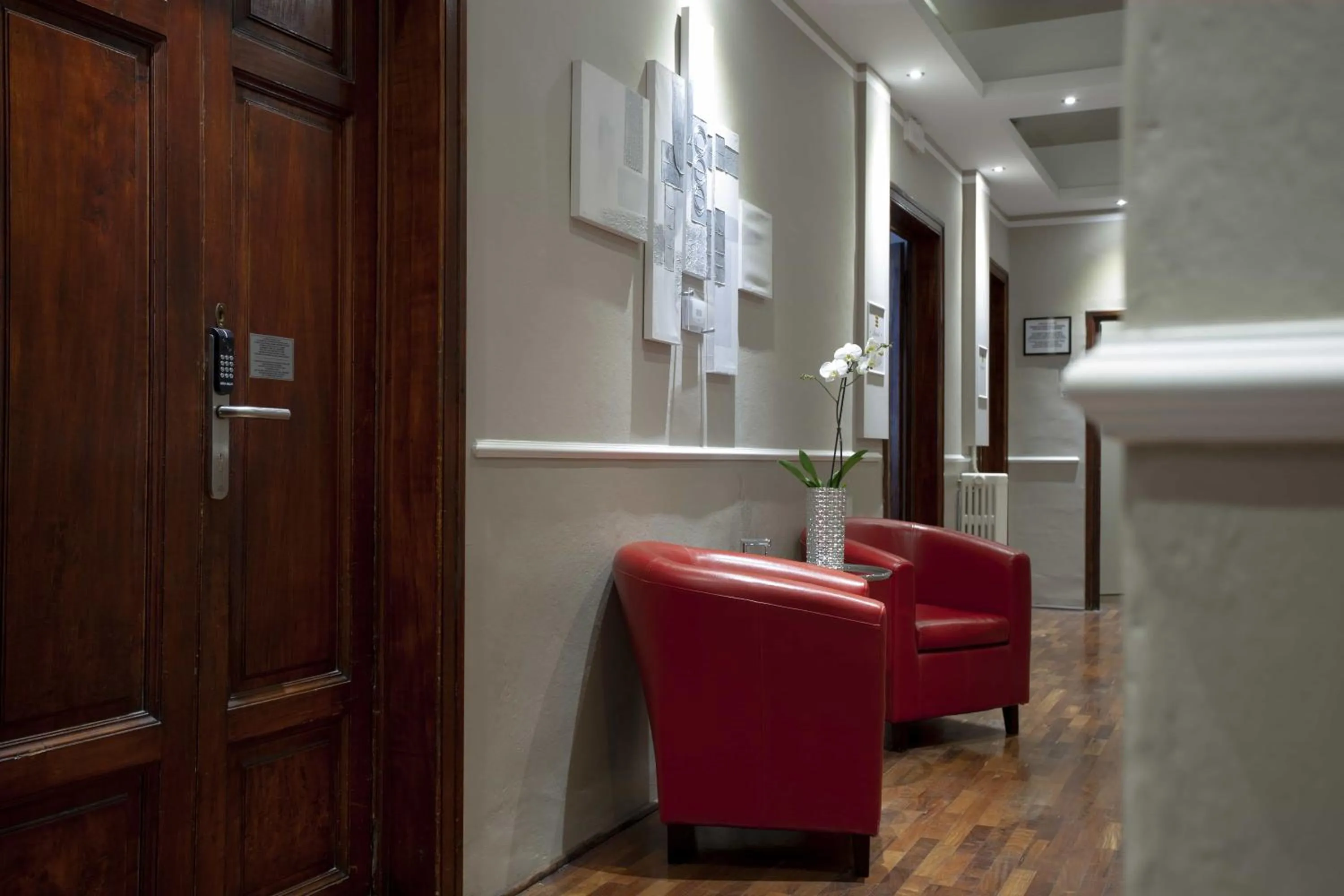 Communal lounge/ TV room in B&B Prestigia Rooms