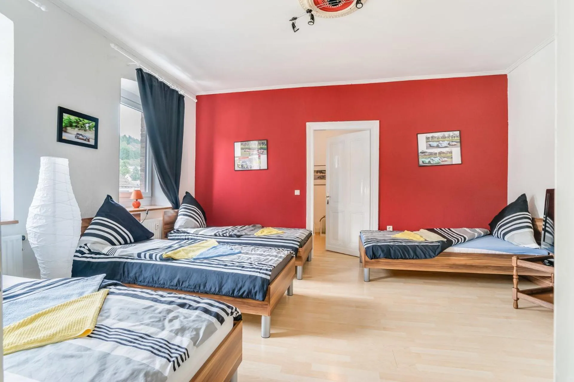 Photo of the whole room, Bed in Nurburgring Rooms Pinocchio