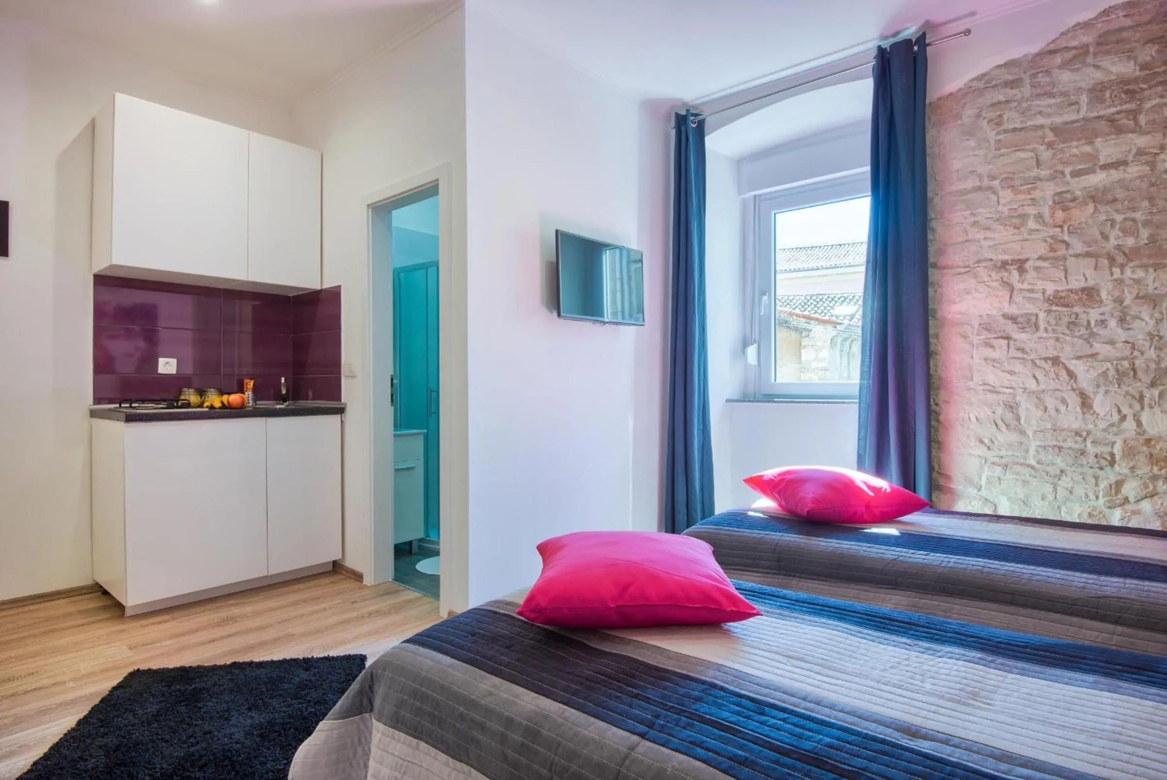 Bed in Top Center Rooms & Studio