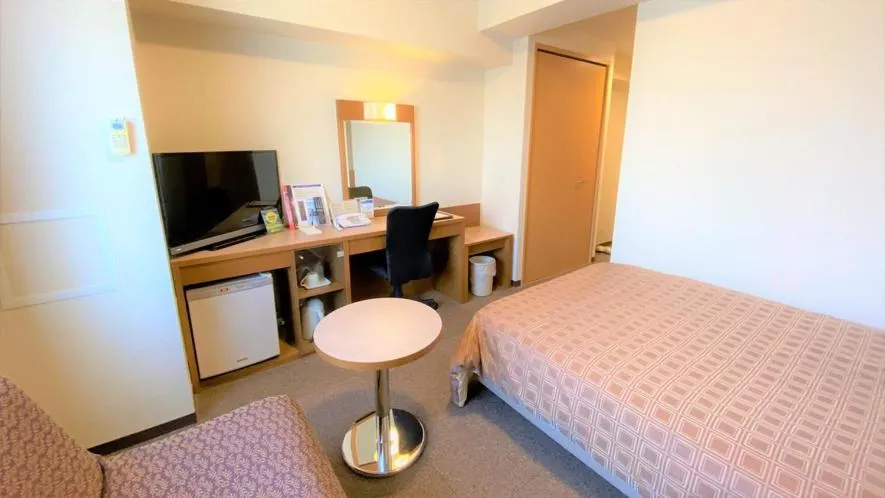 Bed in Ryugasaki Plaza Hotel Shinkan