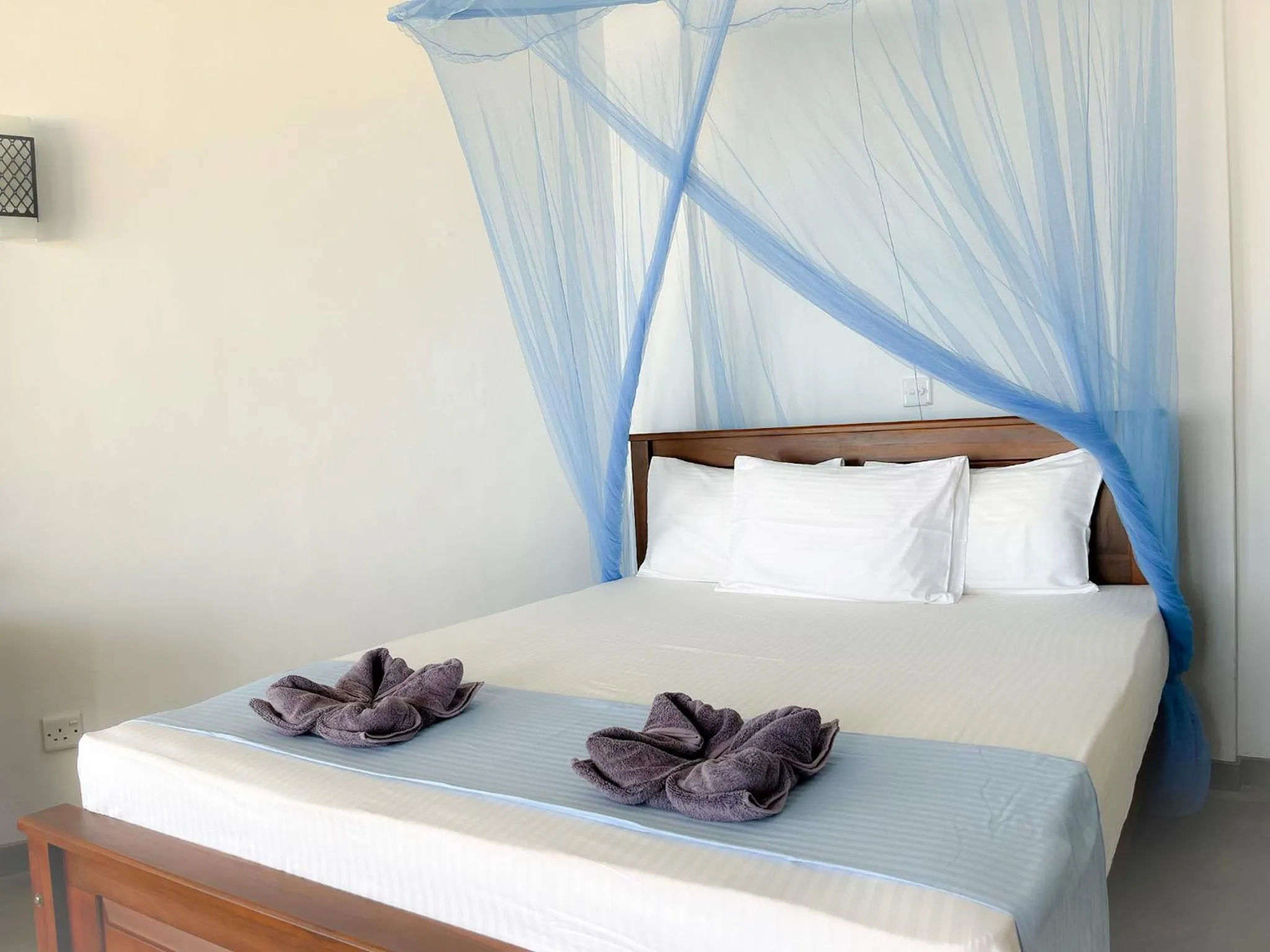 Bed in Pearl Island Beach Hotel