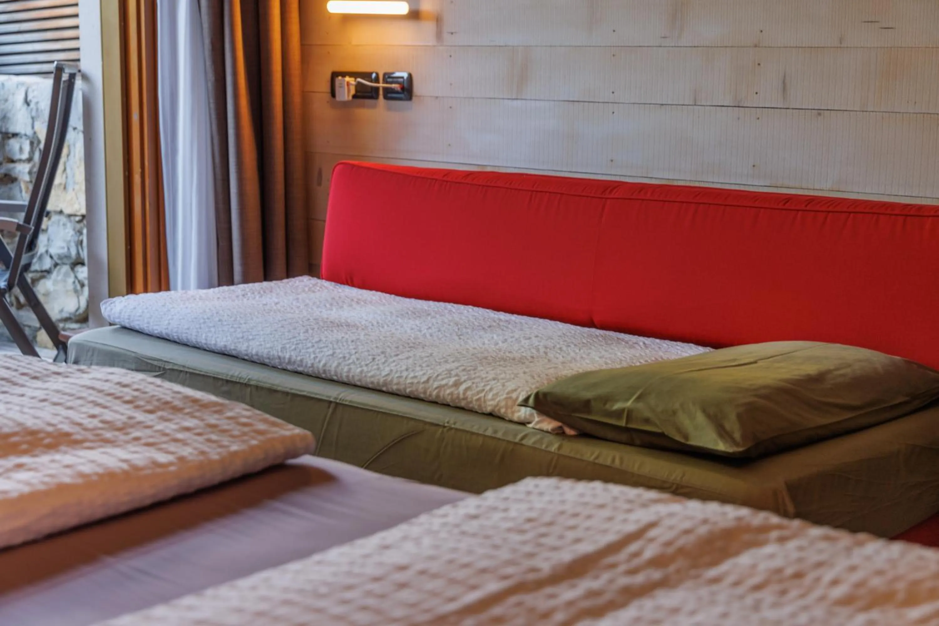 Living room, Bed in Ambienthotel PrimaLuna 3S