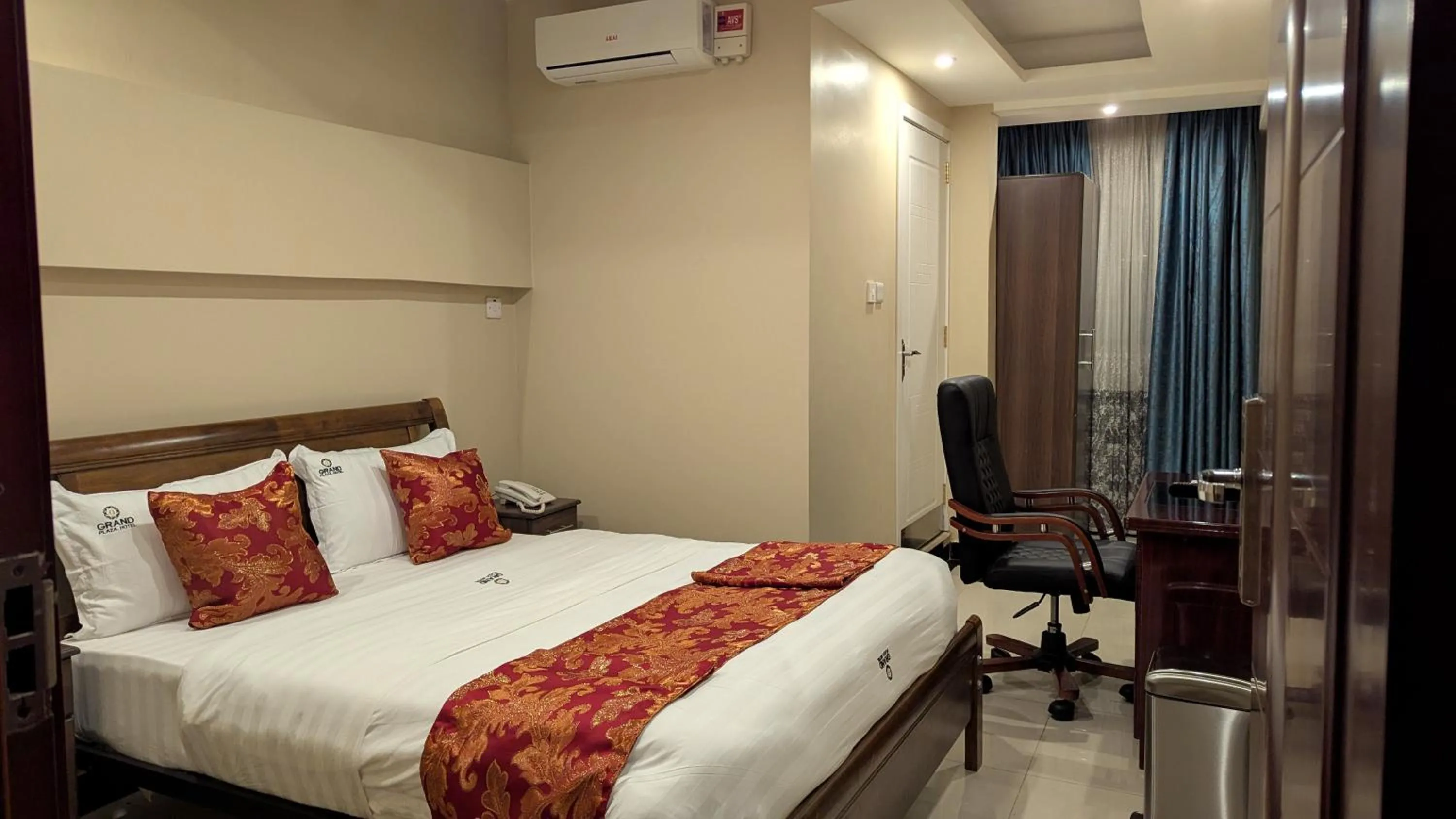 Bed in The Grand Plaza Hotel