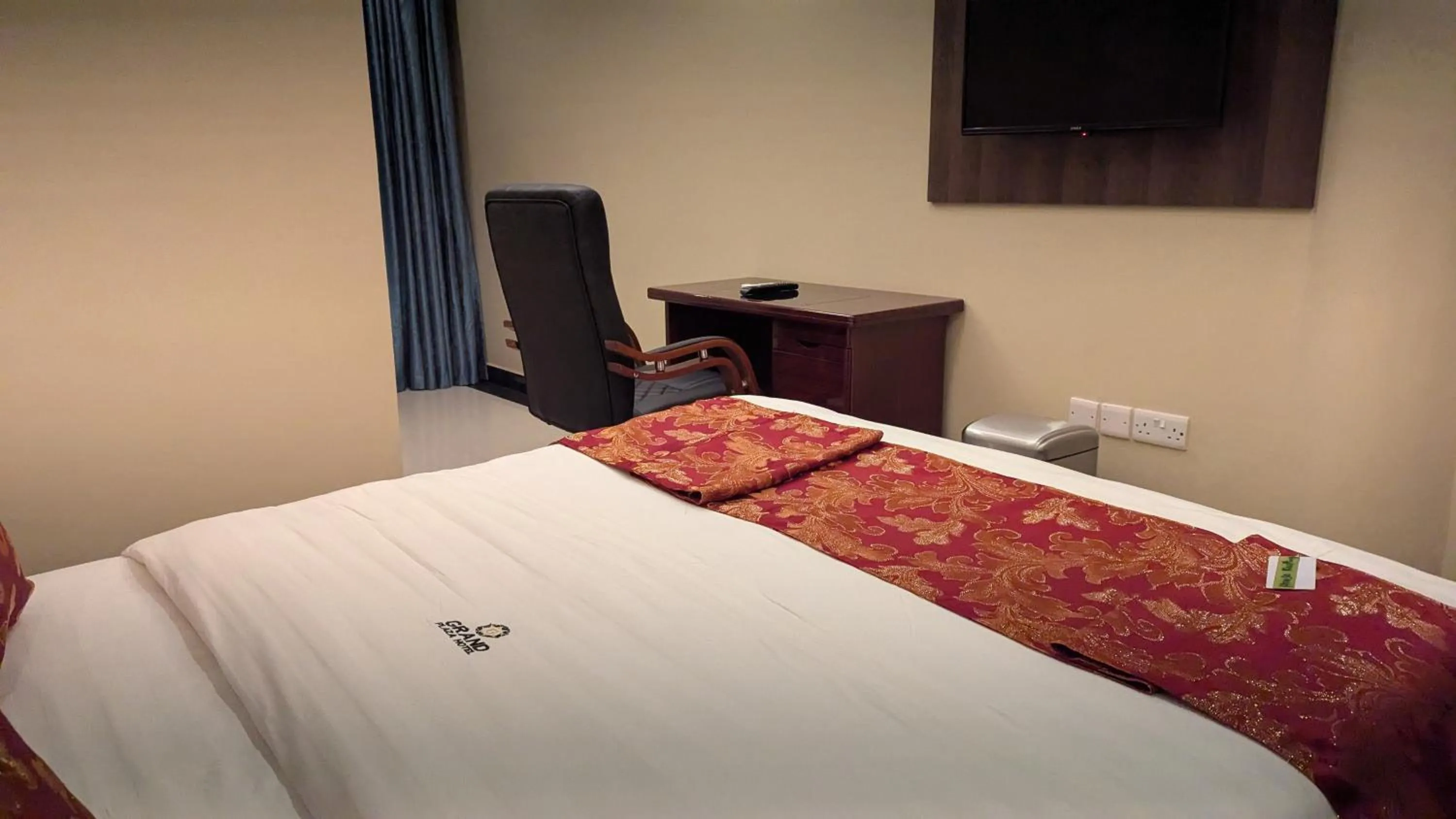 Bed in The Grand Plaza Hotel