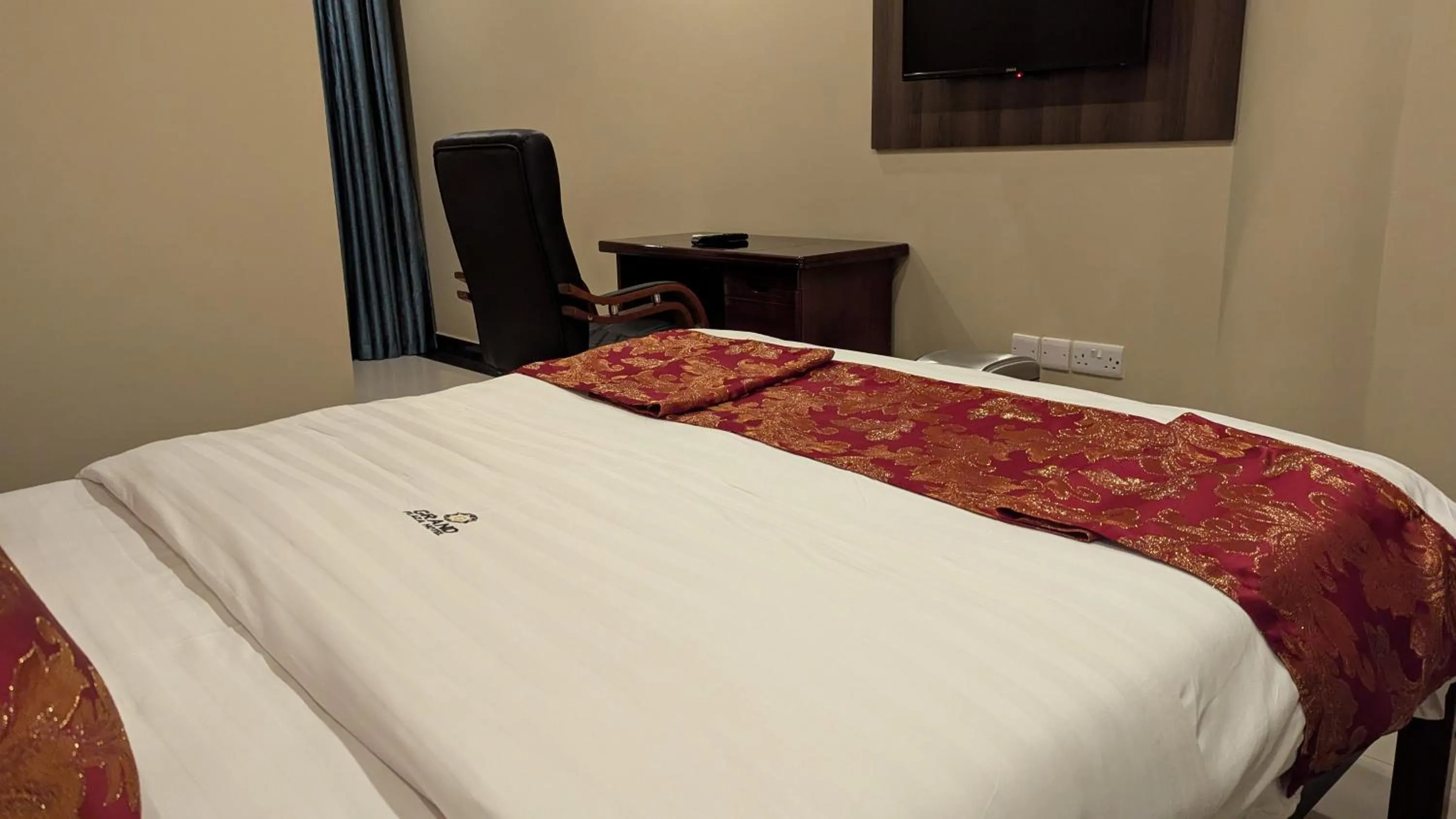Bed in The Grand Plaza Hotel
