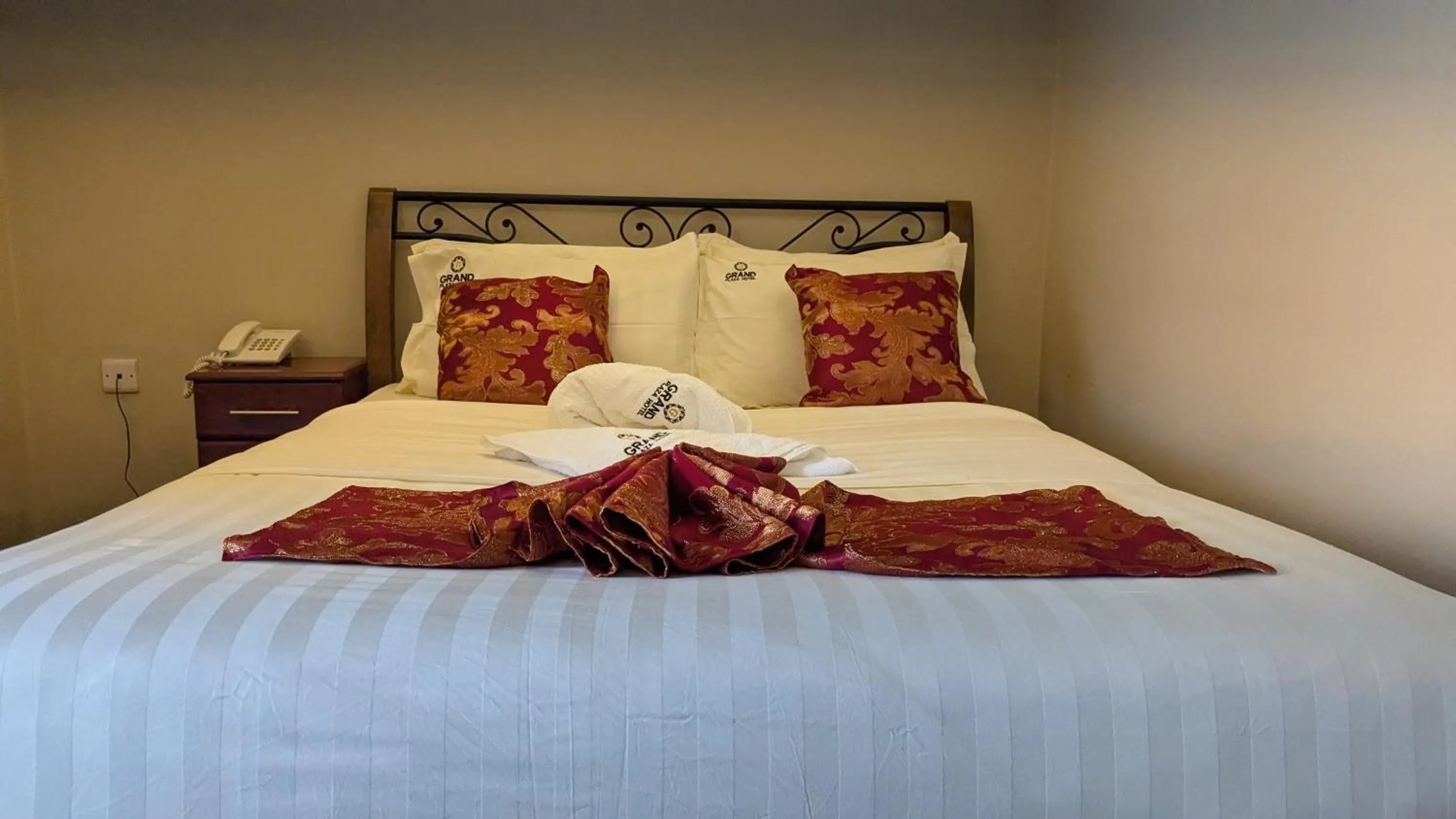Bed in The Grand Plaza Hotel
