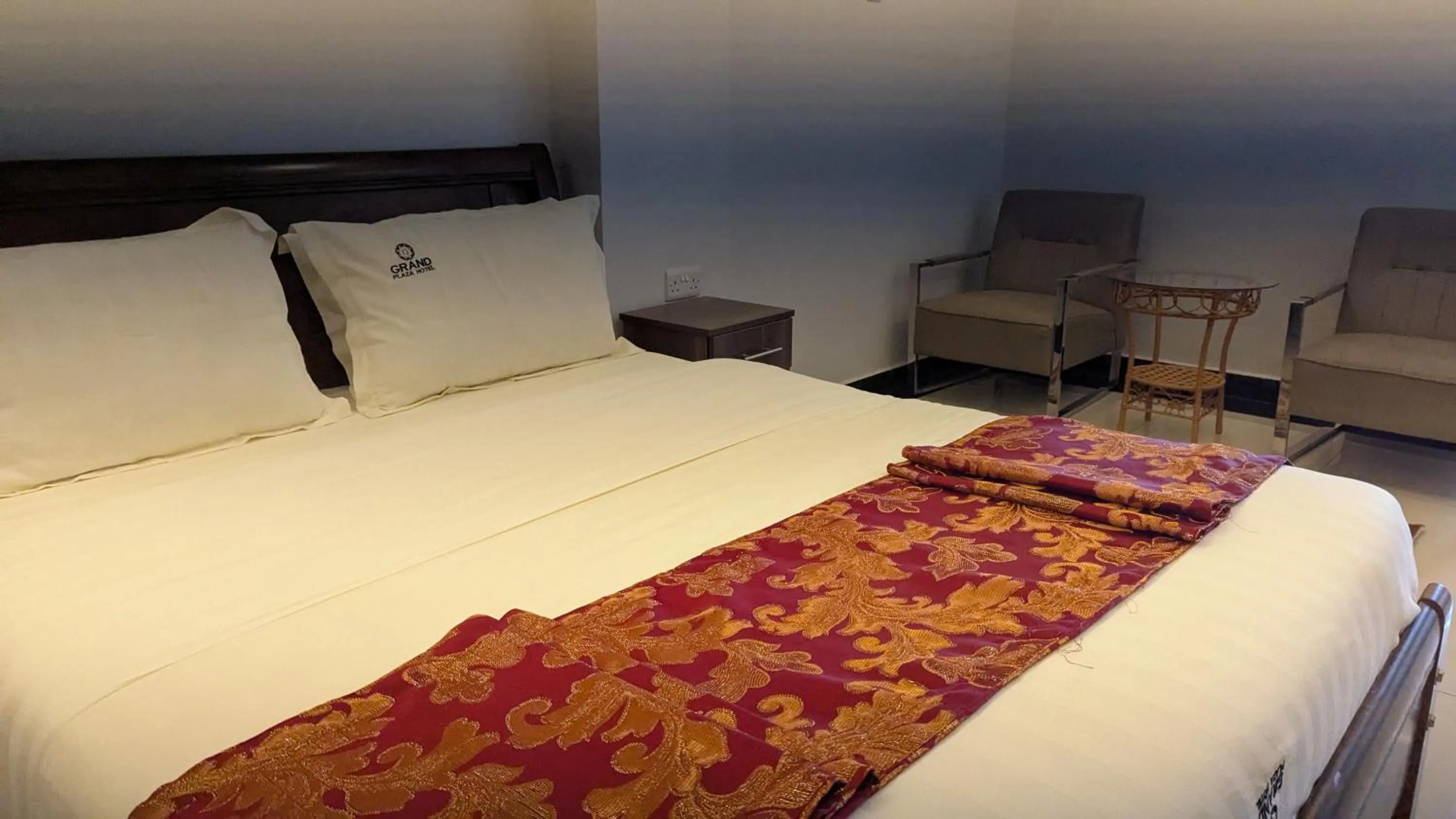 Bed in The Grand Plaza Hotel