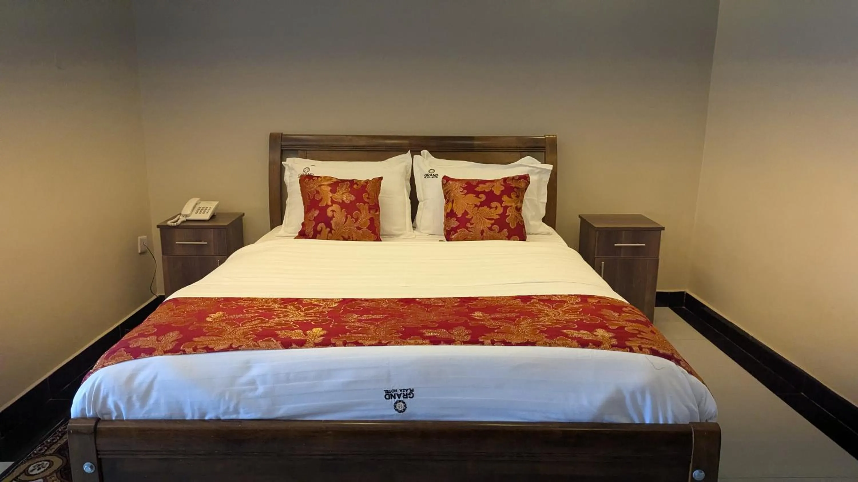 Bed in The Grand Plaza Hotel