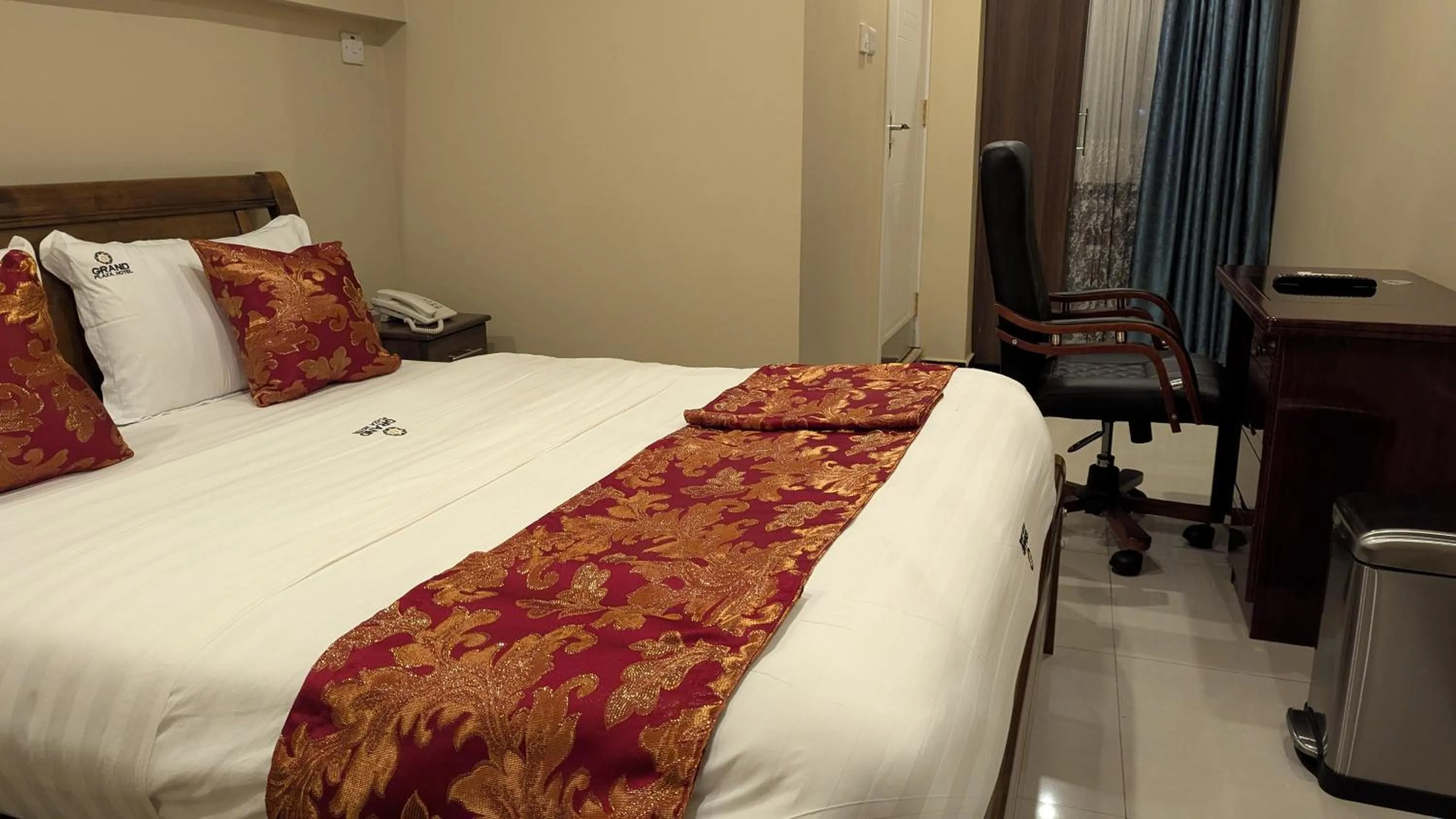 Bed in The Grand Plaza Hotel