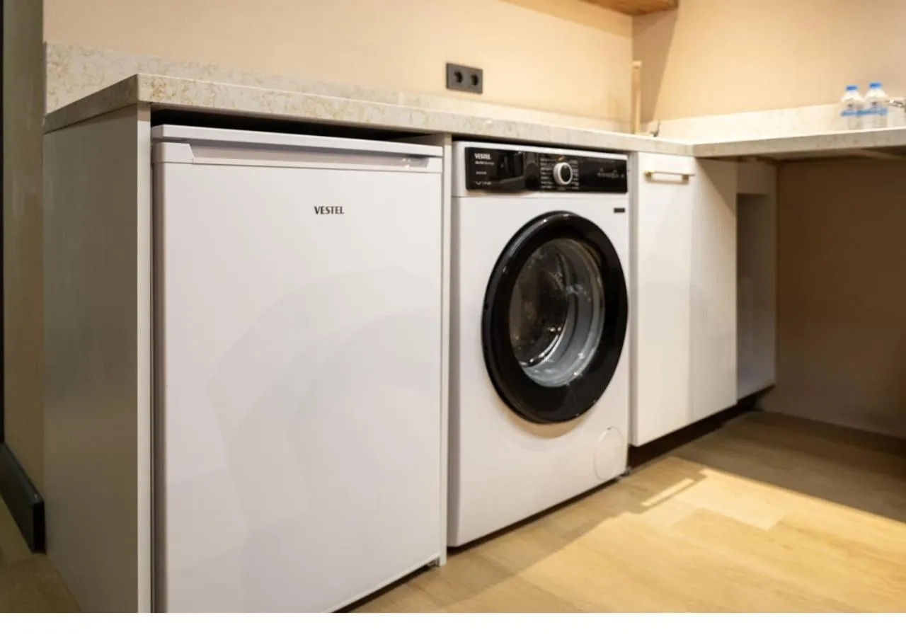 washing machine in Şişli Family Time Suites