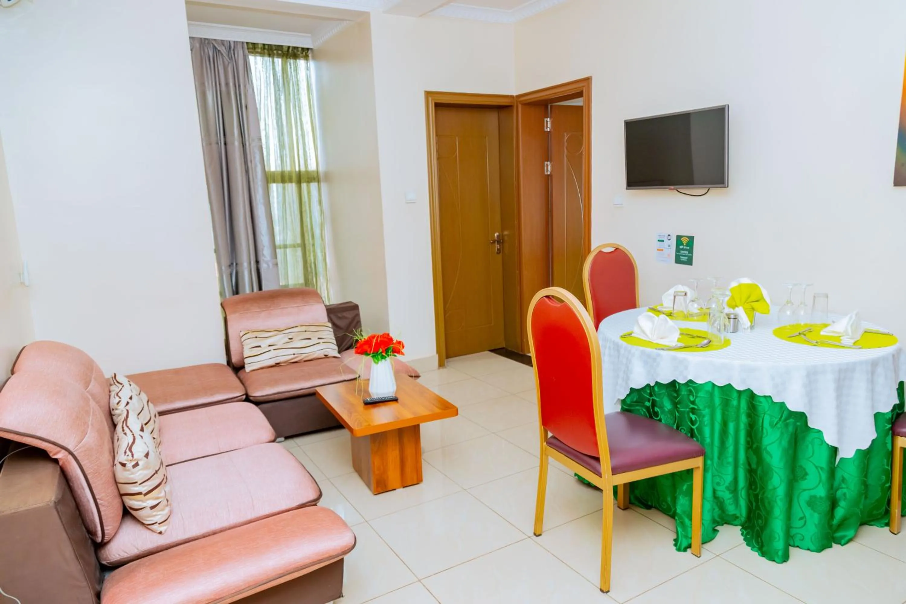 Communal lounge/ TV room in Five to Five Hotel