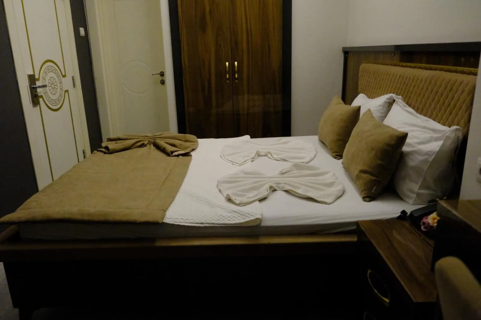 Bed in Grand Diamond Hotel