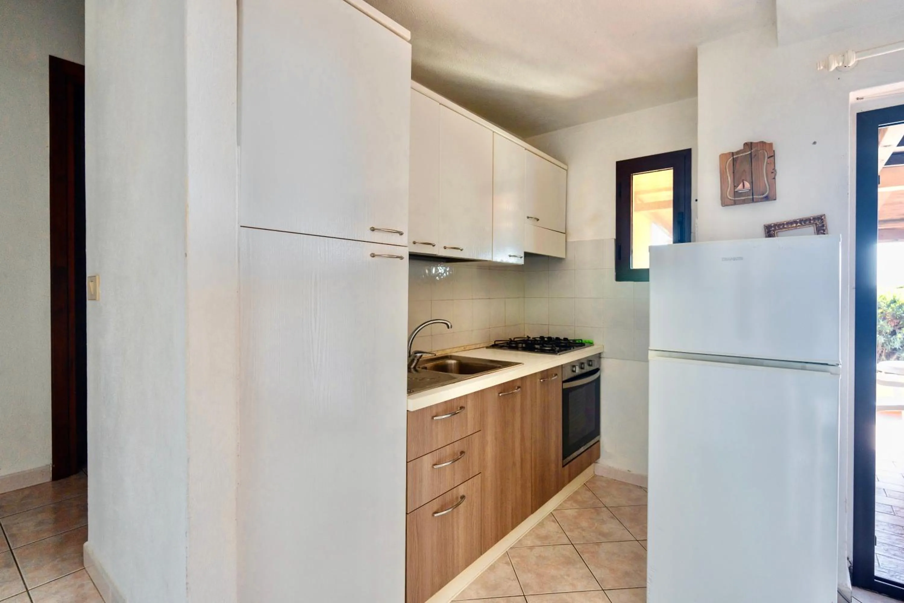 Kitchen or kitchenette in ISA-Residence with swimming-pool in Costa Paradiso, apartments 6 beds with private outdoor area