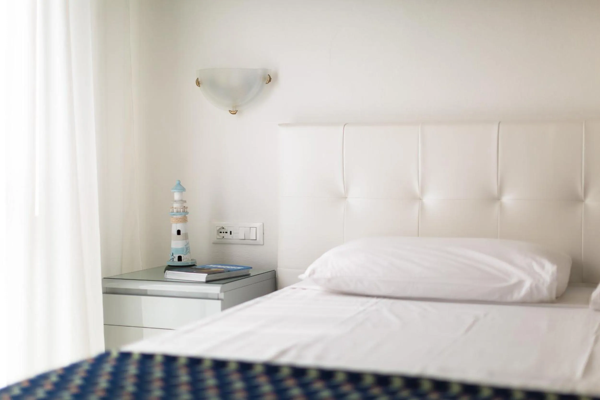 Decorative detail, Bed in Hotel Cavallino Bianco