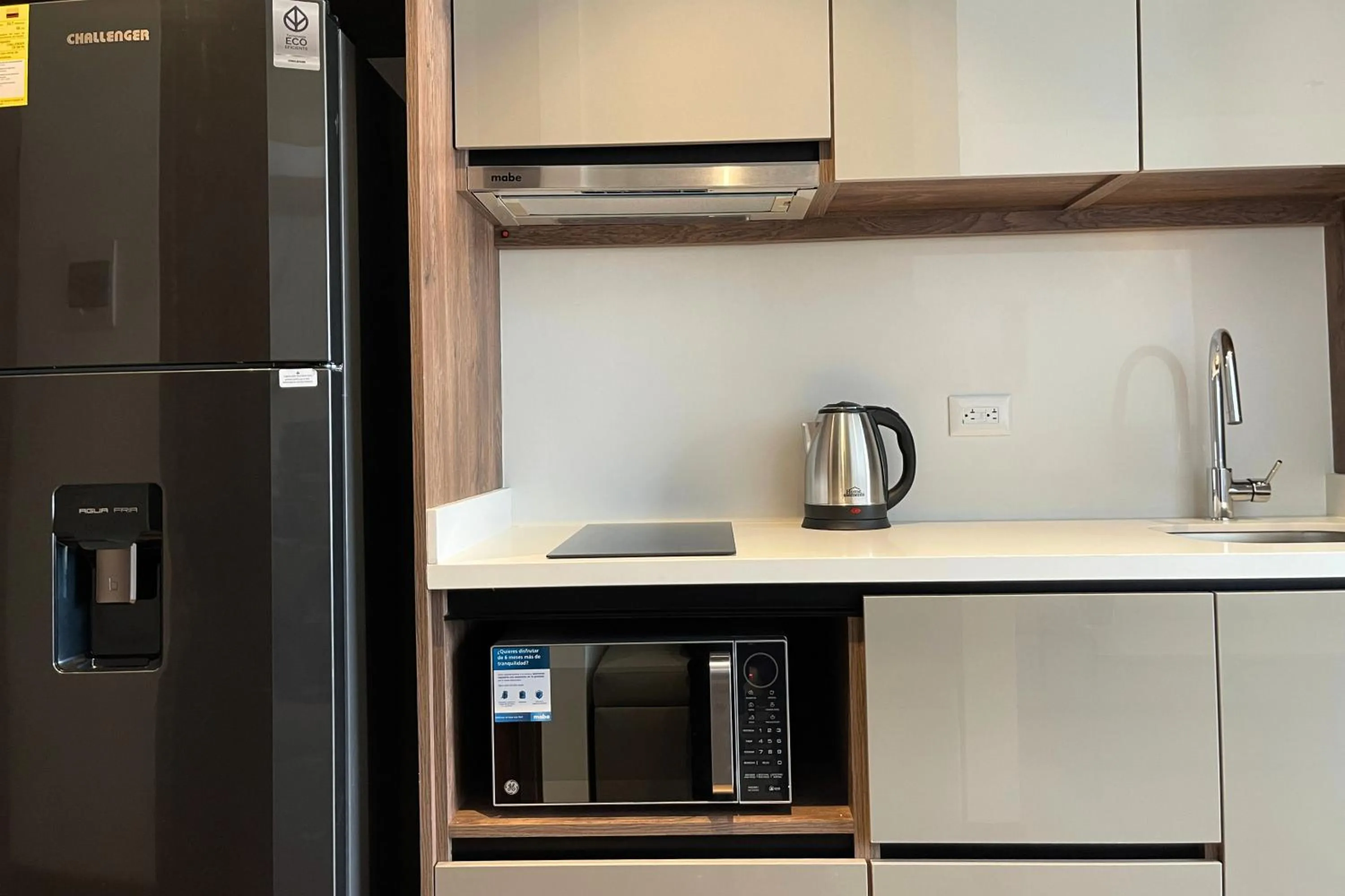Kitchen or kitchenette in VOU Suites by Avia Suites