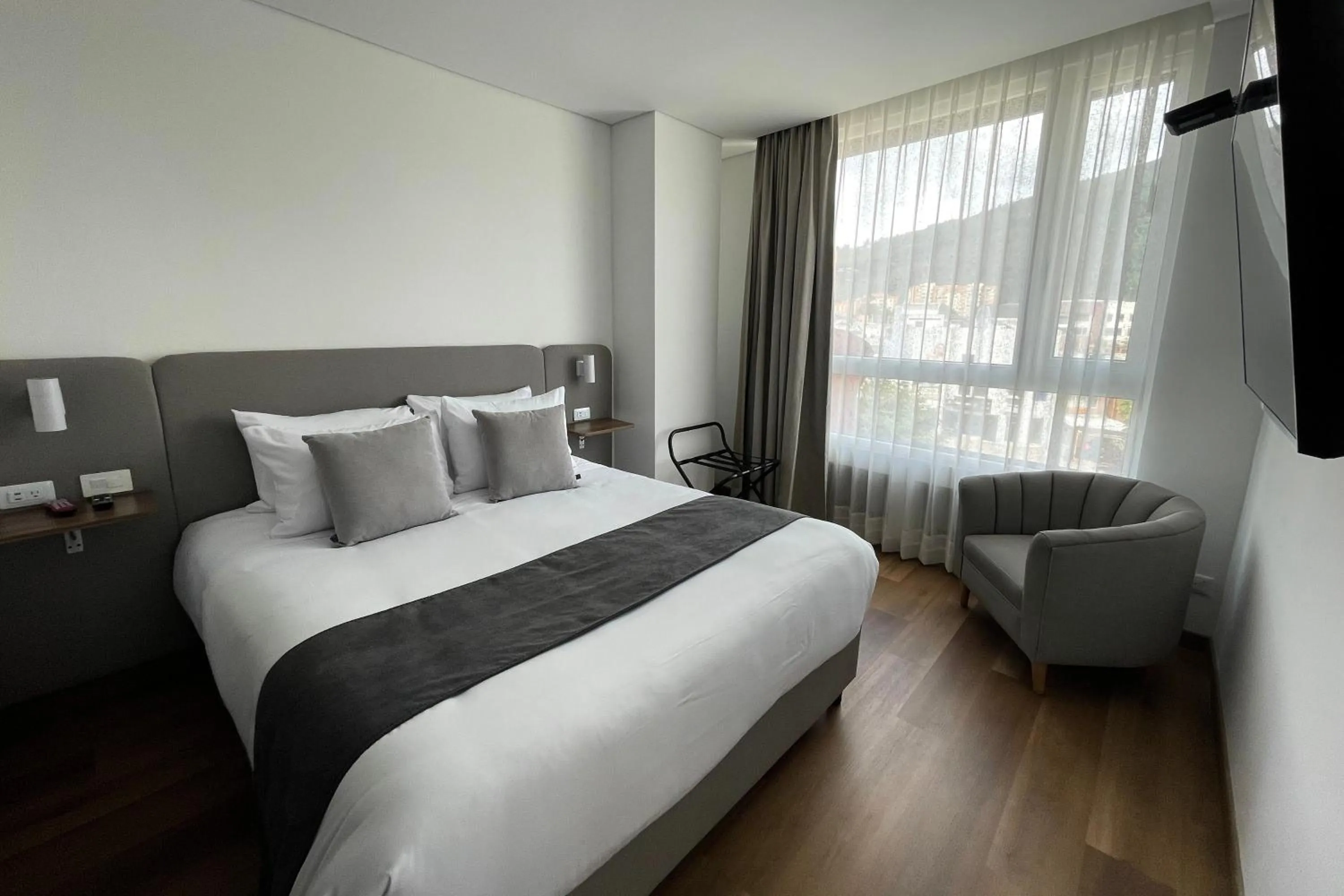 Bed in VOU Suites by Avia Suites