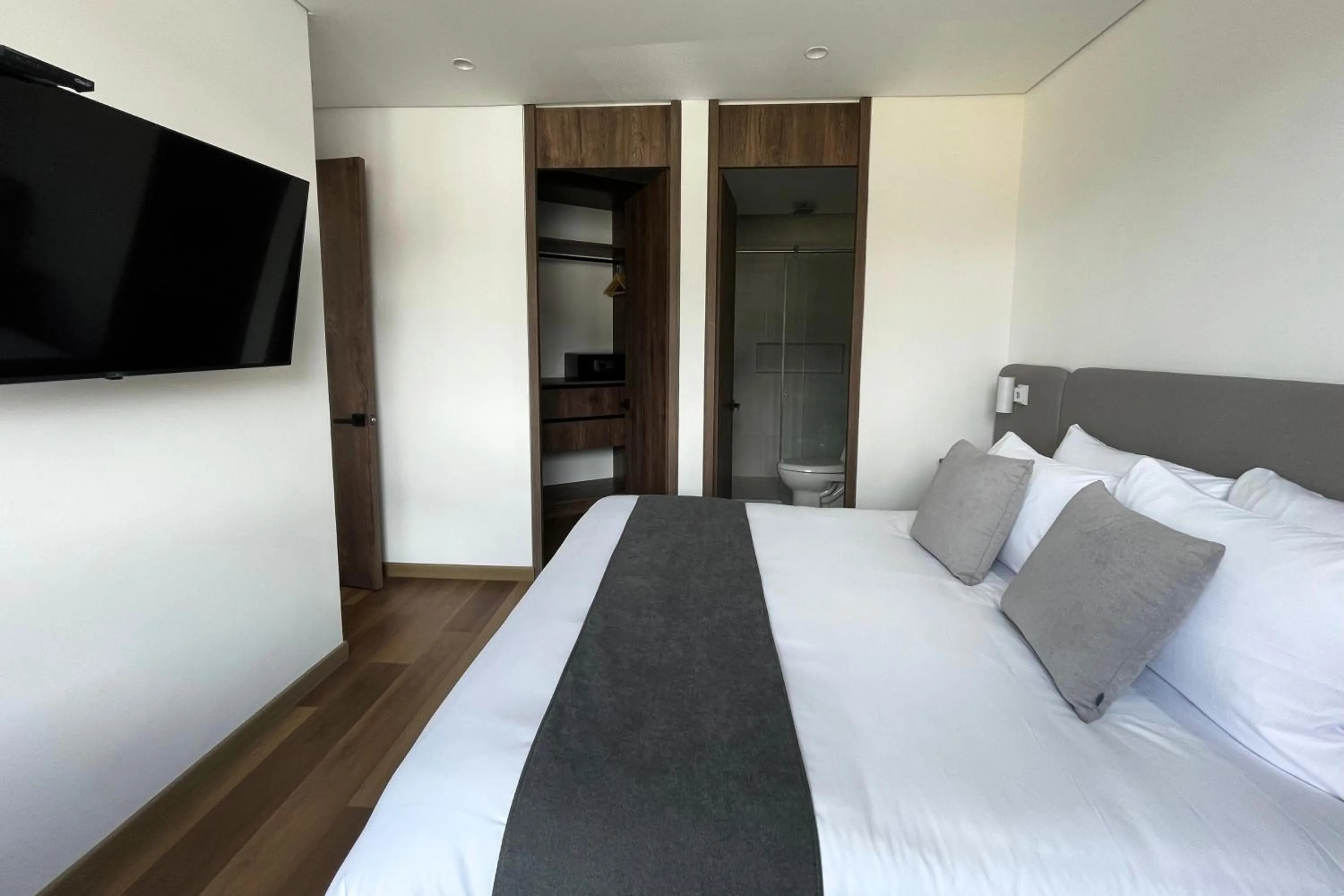 Bed in VOU Suites by Avia Suites