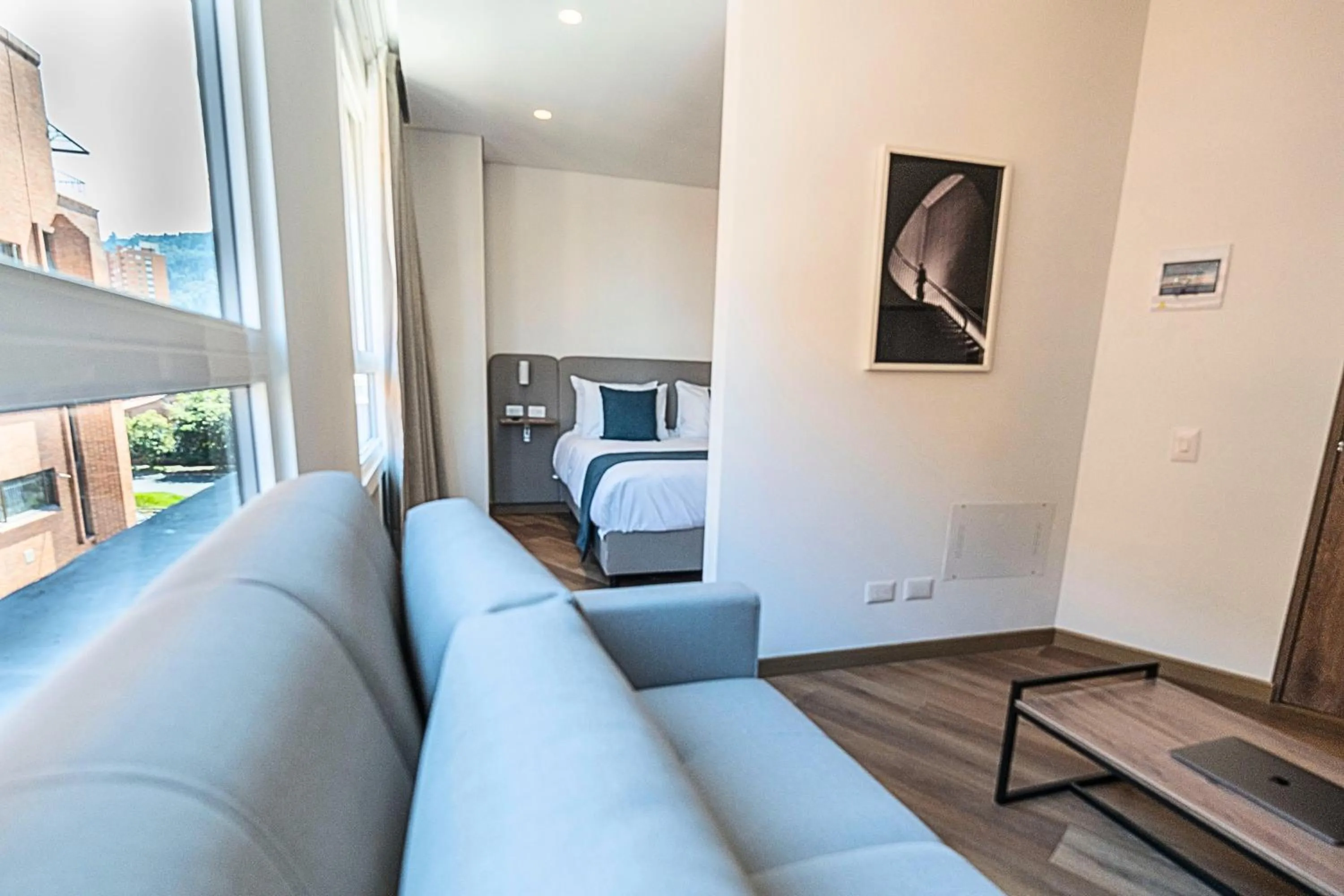 Living room, Bed in VOU Suites by Avia Suites