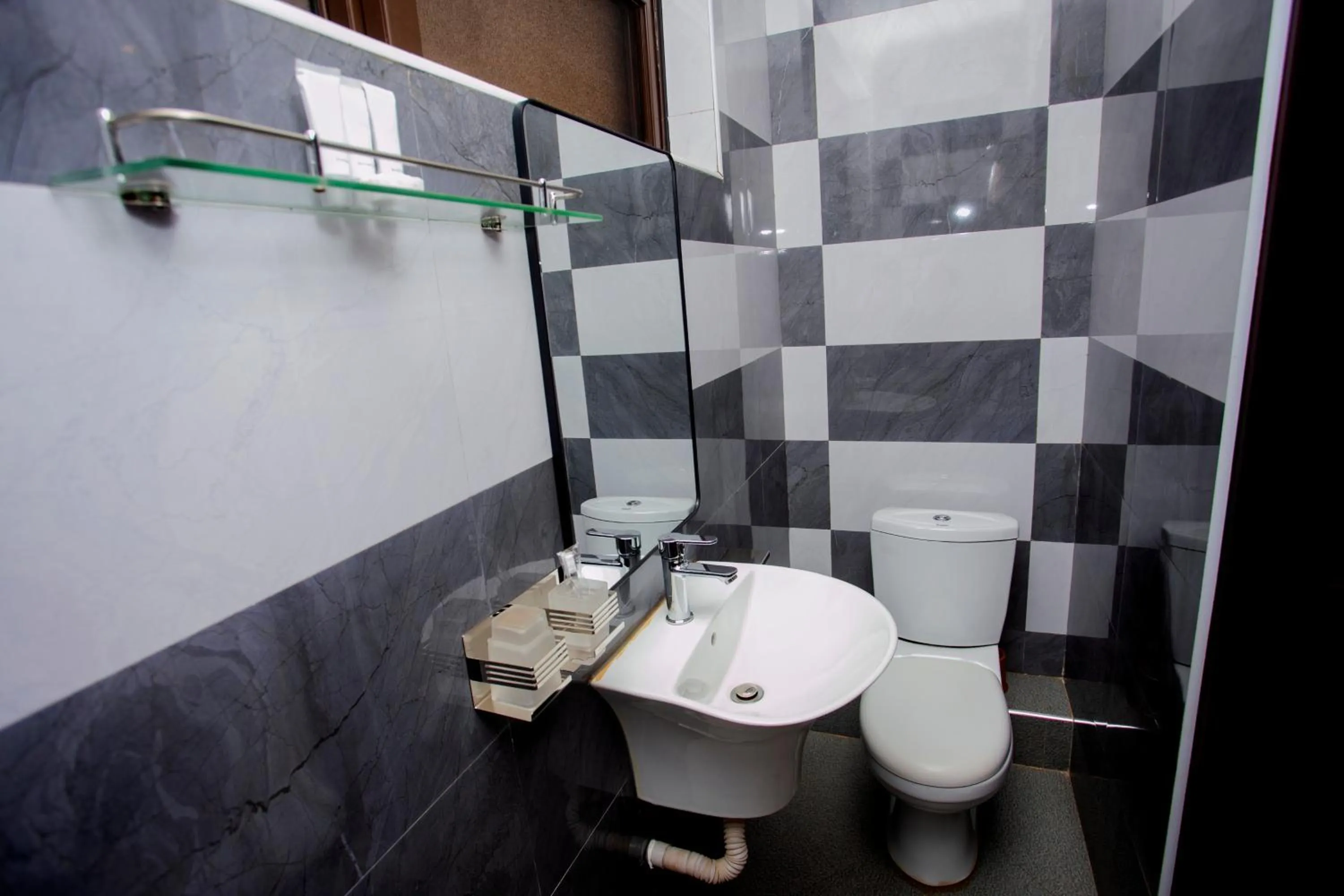 Toilet in Kaloni Hotels