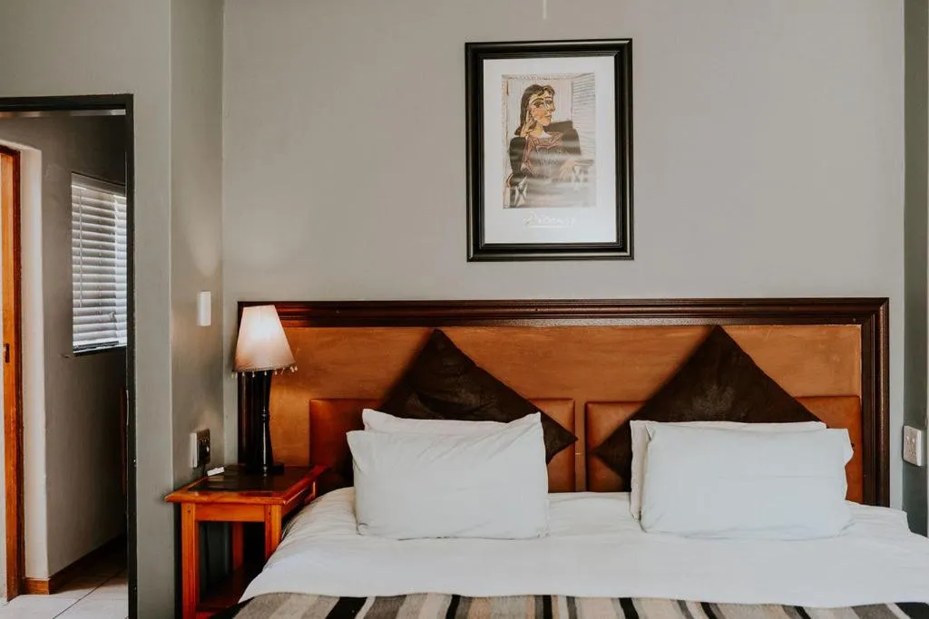 Bed in Ons Dorpshuis Guesthouse