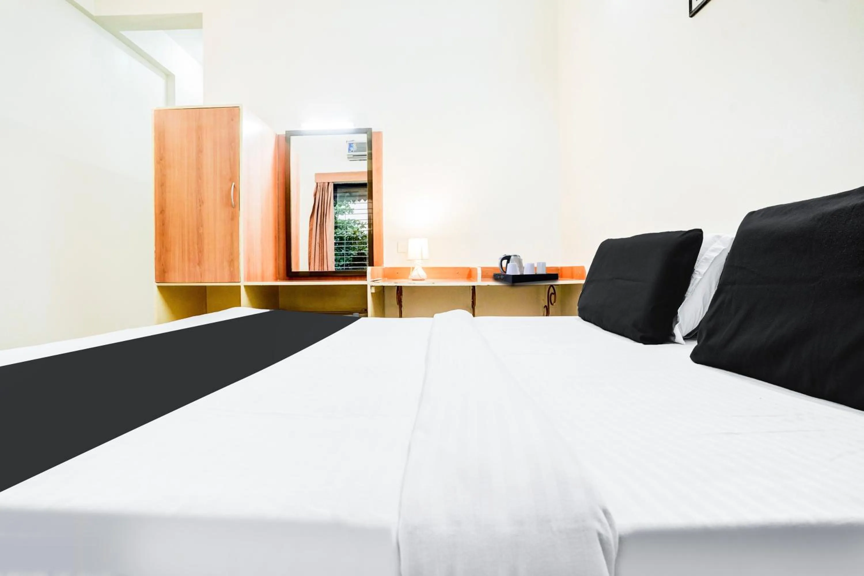 Bedroom, Bed in Super Hotel O Nashik