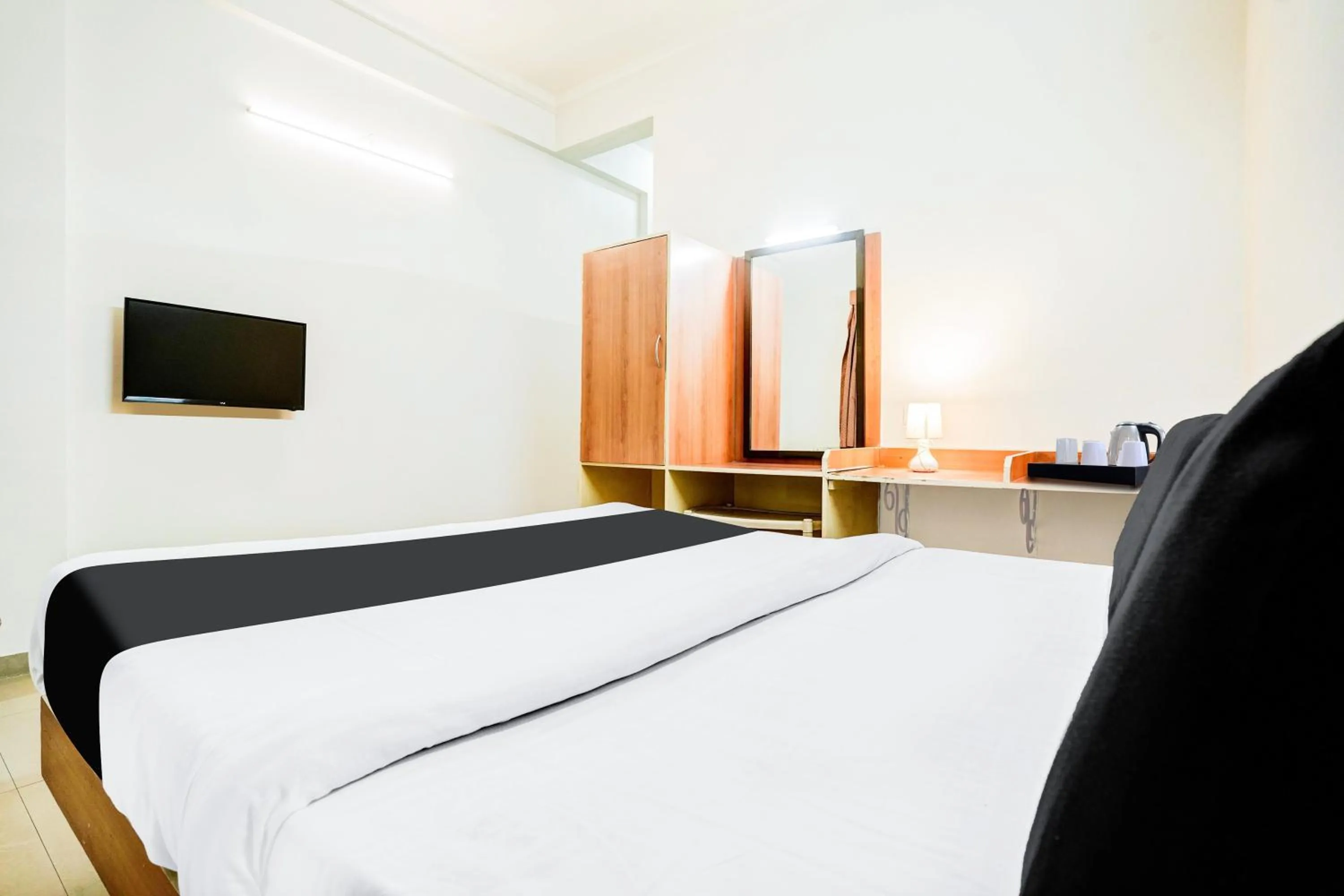 Bedroom, Bed in Super Hotel O Nashik