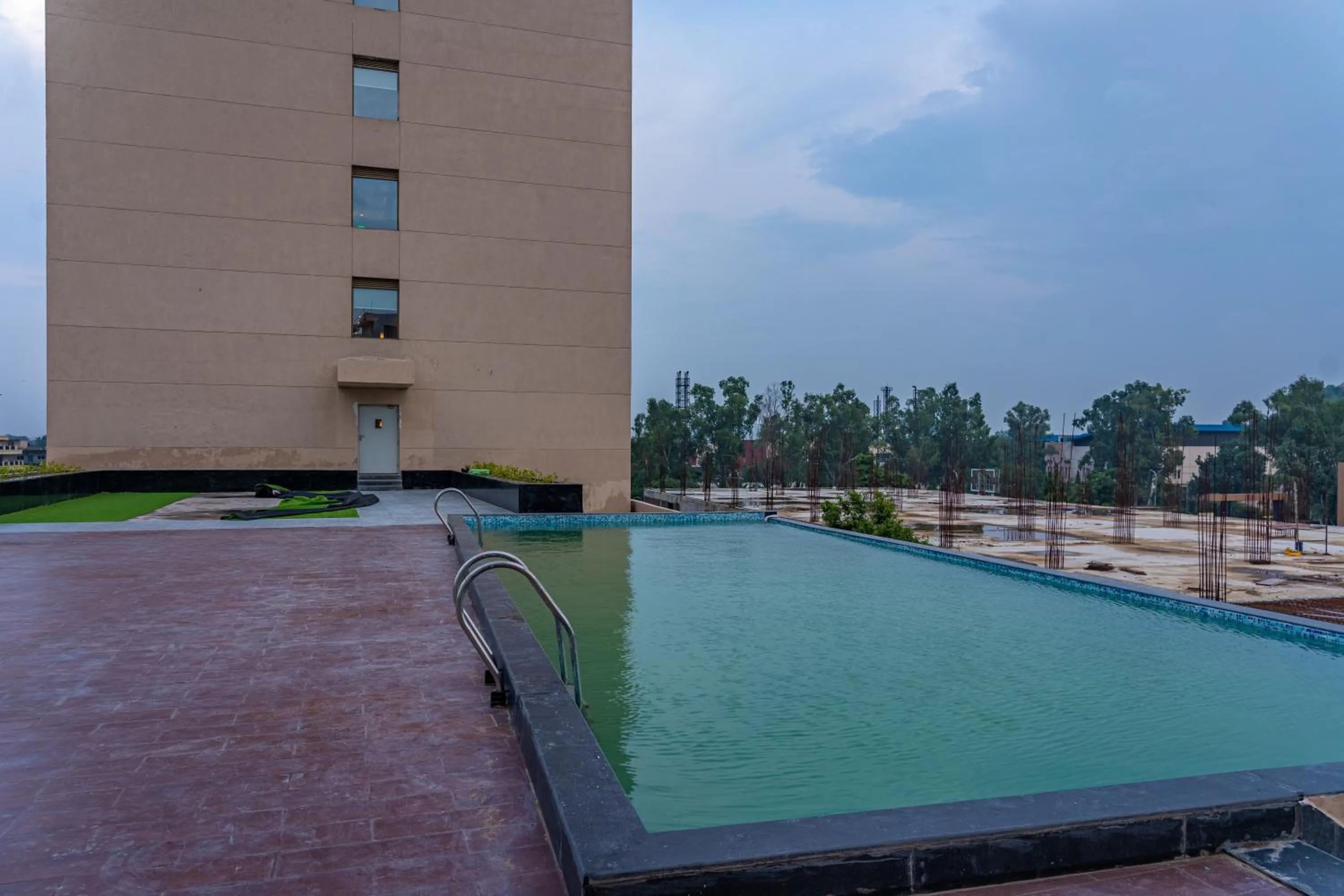 Swimming pool in Ramada Encore By Wyndham Bhiwadi Phool Bagh Chowk