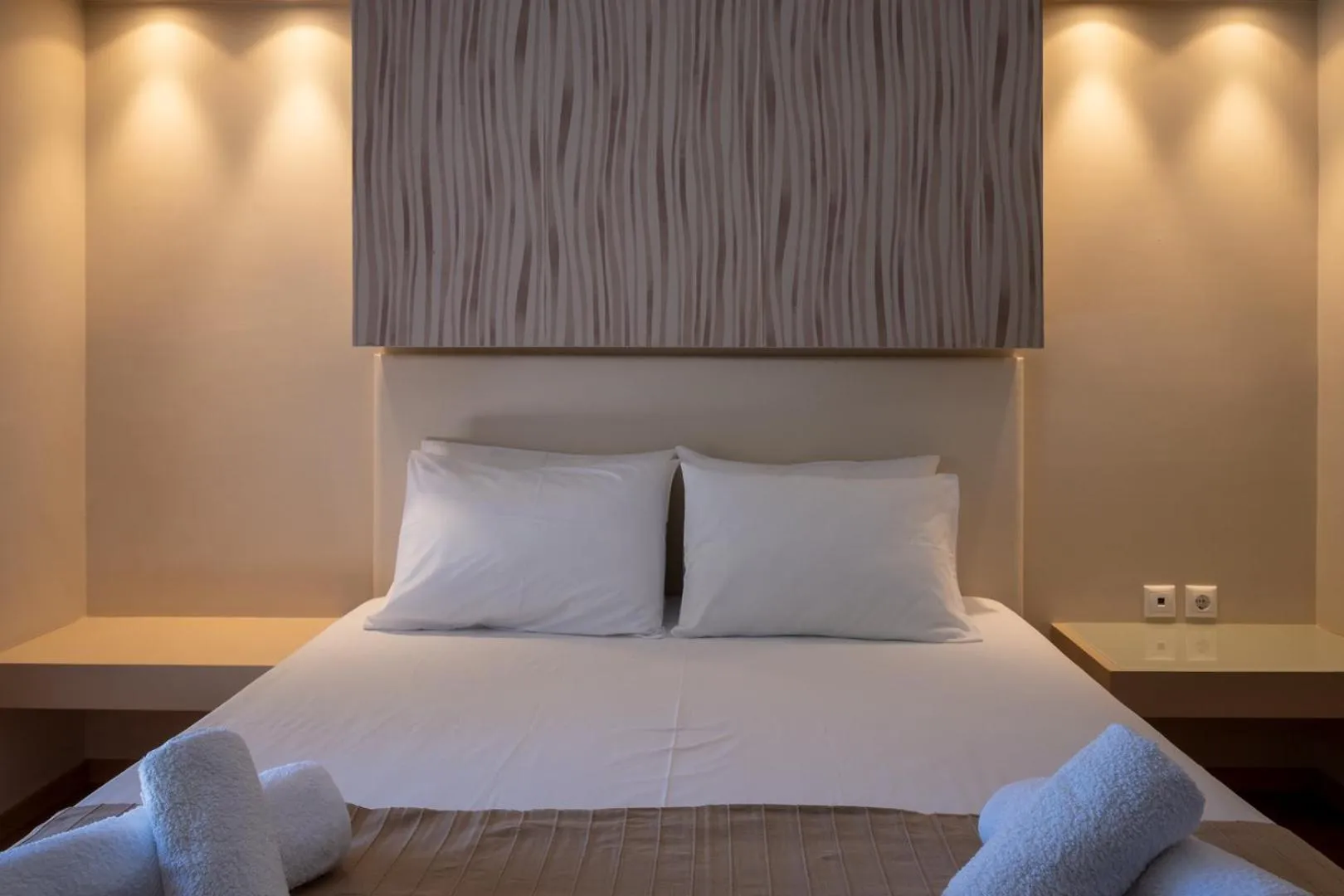 Bed in Triantafillas Suites