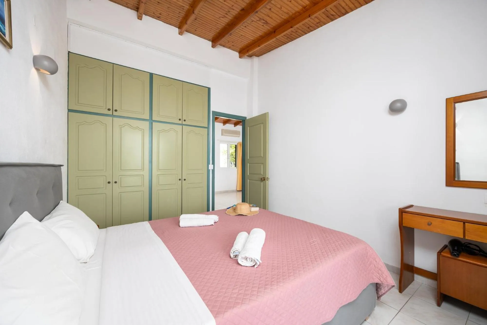 Bed in Nissaki Sea View Hotel