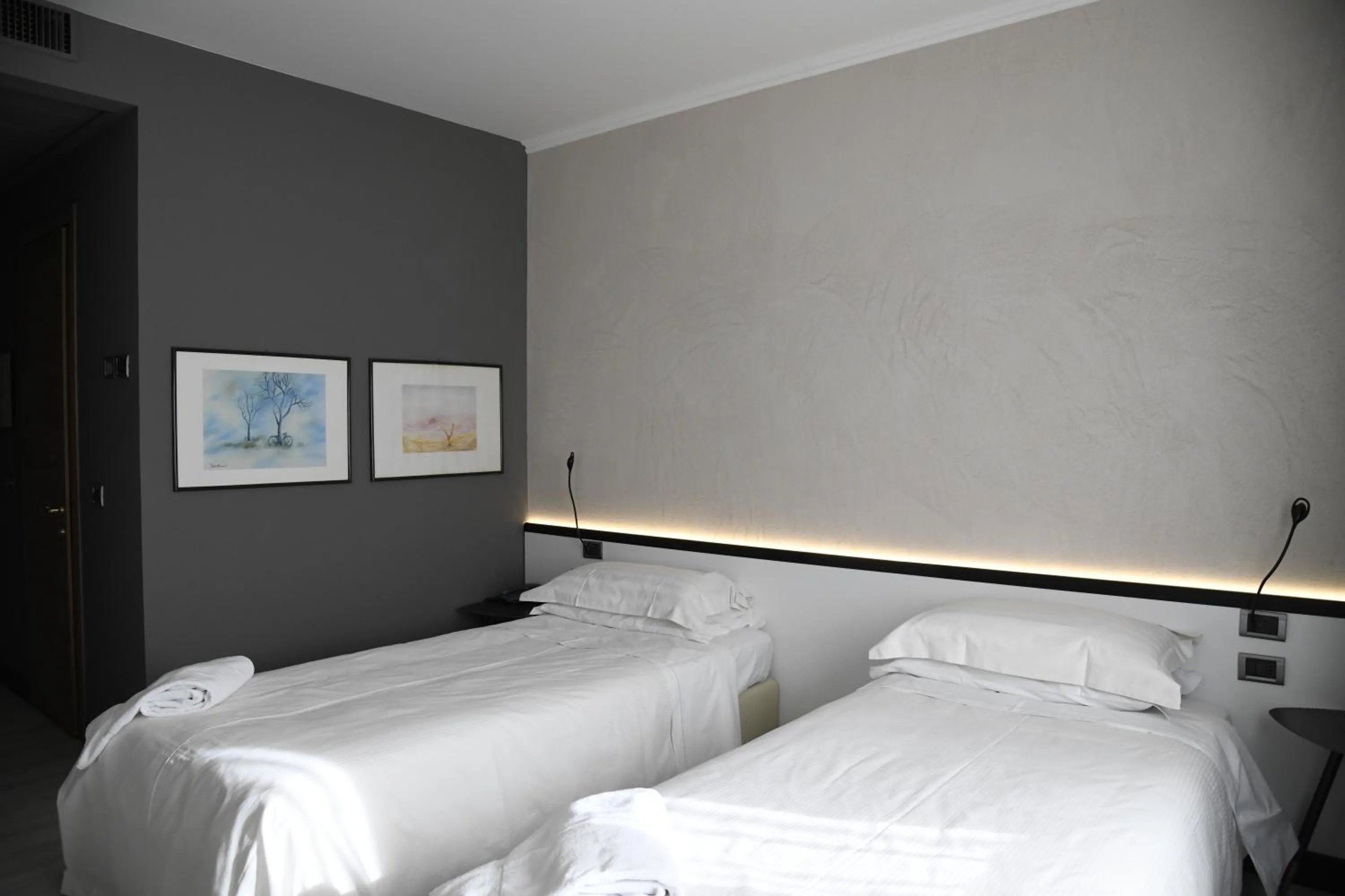 Bed in Brianteo Hotel Residence and Restaurant