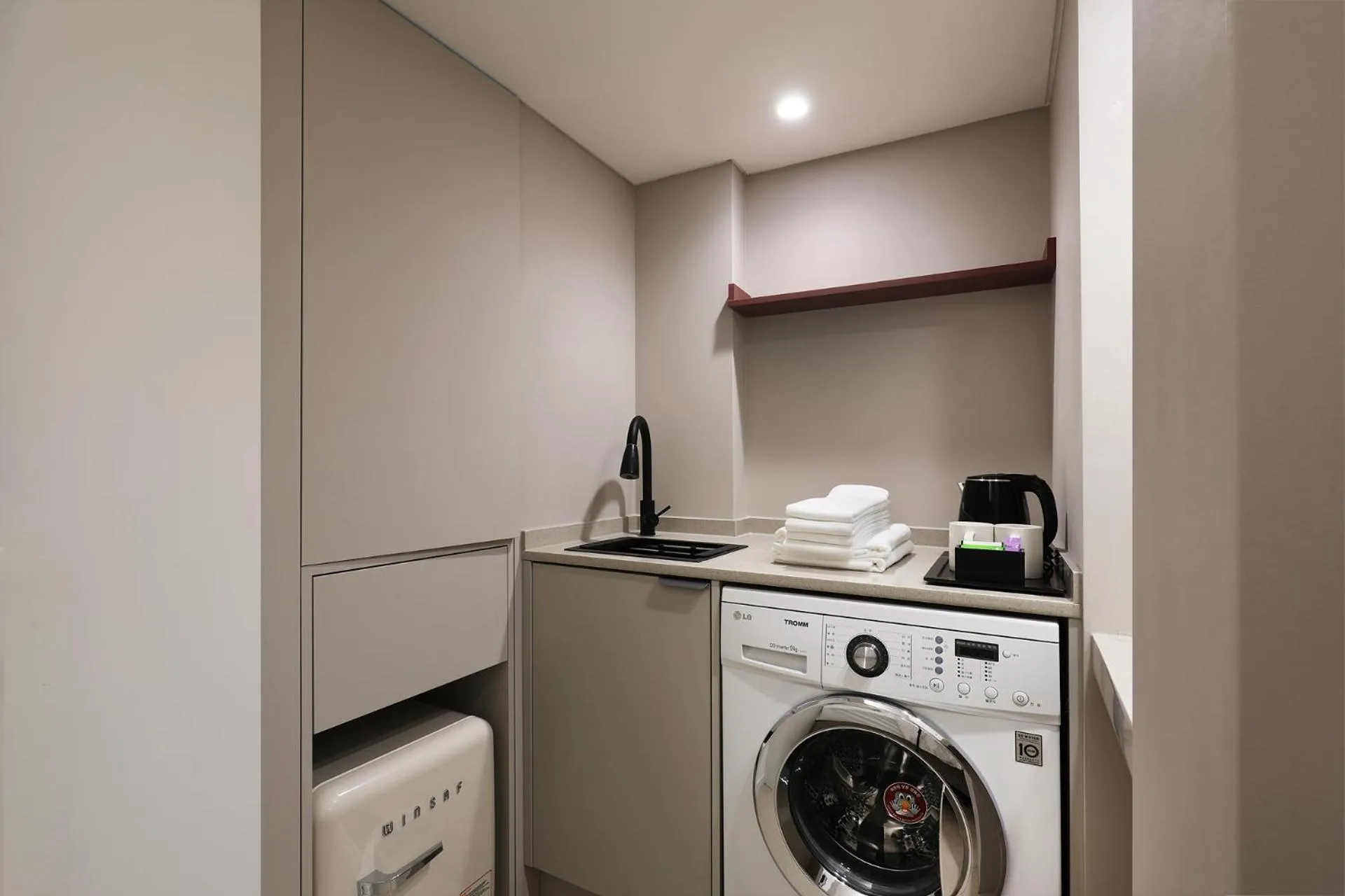 washing machine in Seoul Inn Hotel by The Designers